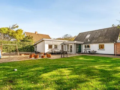 a house with a large yard with a backyard at Holiday Home Missa - 2km to the fjord by Interhome in Ejerslev