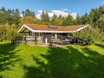 a house with a roof with a grass yard at Holiday Home Inola - 3-5km from the sea by Interhome in Fjerritslev