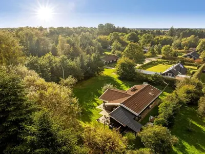 an aerial view of a house in a forest at Holiday Home Inola - 3-5km from the sea by Interhome in Fjerritslev
