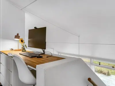 a computer sitting on a desk in a room at Holiday Home Adelbrand - 1km from the sea by Interhome in Blokhus
