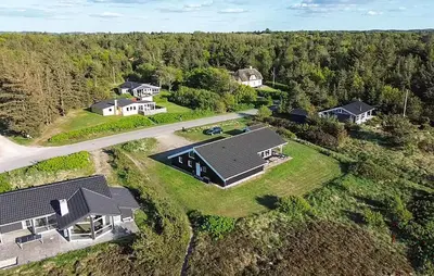 an aerial view of a home with a driveway and houses at Cozy Home In Løgstør With Sauna in Løgstør