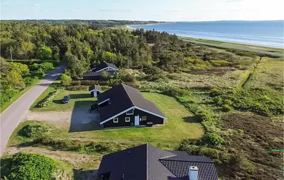 an aerial view of a house on the beach at Cozy Home In Løgstør With Sauna in Løgstør