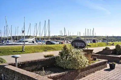 a sign in front of a marina with boats at G346-Lemvig-Vinkelhagevej-46 in Lemvig