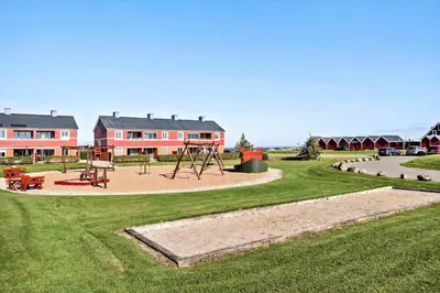a park with a playground in front of a building at G346-Lemvig-Vinkelhagevej-46 in Lemvig