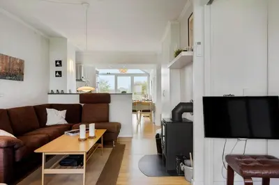 a living room with a couch and a table at G186-Lemvig-Vinkelhagevej-186 in Lemvig