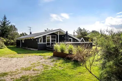 a small black house in the middle of a yard at 1334-Thisted-Ingerslevvej-14 in Thisted