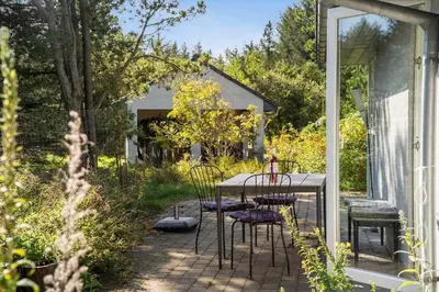 a table and chairs sitting on a patio at 852-Bedsted-Thy-Istrupvej-35 in Bedsted Thy