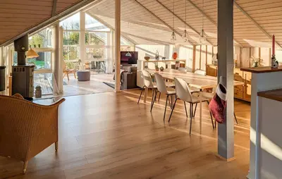 a kitchen and dining room with a table and chairs at Amazing Home In Spøttrup With House A Panoramic View in Spottrup