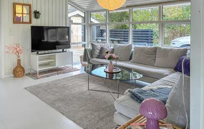 a living room with a couch and a tv at Lovely Home In Fjerritslev With Wifi in Fjerritslev