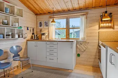a kitchen with white cabinets and a window at 1069-Thisted-Kobbelsti-23 in Thisted
