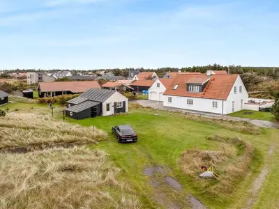 an aerial view of a house with a car in a yard at Holiday Home Sylvana - 75m from the sea by Interhome in Thisted