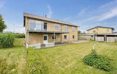 a house with a large yard in front of it at Awesome Home In Thisted With House Sea View in Thisted