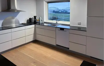 a white kitchen with a sink and a window at Awesome Home In Thisted With House Sea View in Thisted