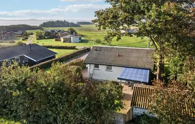 an aerial view of a house with a solar panel on the roof at Amazing Home In Snedsted With Wifi in Snedsted