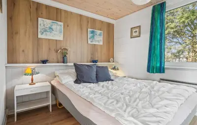 a bedroom with a large white bed and a window at Amazing Home In Snedsted With Wifi in Snedsted