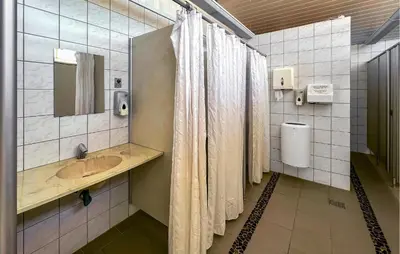 a bathroom with a sink and a shower at Beautiful Home In Hanstholm With Swimming Pool in Hanstholm