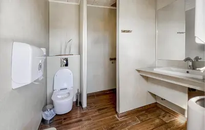 a bathroom with a toilet and a sink at Beautiful Home In Hanstholm With Swimming Pool in Hanstholm