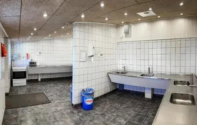 a public bathroom with two sinks and a tub at Beautiful Home In Hanstholm With House A Panoramic View in Hanstholm