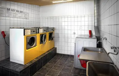 a laundry room with two washers and a sink at 2 Bedroom Beautiful Home In Hanstholm in Hanstholm