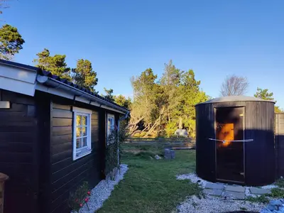 a out house with a dog inside of it at Cozy Cottage Close To Thy National Park in Thisted