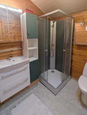a bathroom with a shower and a toilet at Cozy Cottage Close To Thy National Park in Thisted