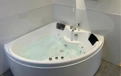 a white bath tub with a sink in a bathroom at Awesome Home In Thyborøn With Wifi in Thyborøn