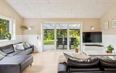 a living room with a couch and a tv at Gorgeous Home In Farsø With Wifi in Farsø