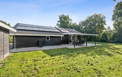 a house with a solarium and a yard at Gorgeous Home In Farsø With Wifi in Farsø