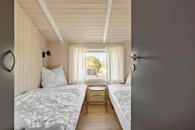 a small room with two beds and a window at JB368-Fjerritslev-Ahornvej-38