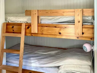 a bunk bed with two bunk beds in a room at Nature Retreat With Fjord Views Near Spøttrup in Spottrup