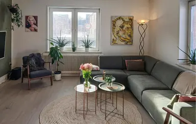 a living room with a couch and a table at Nice Home In Thyholm With Wifi in Thyholm