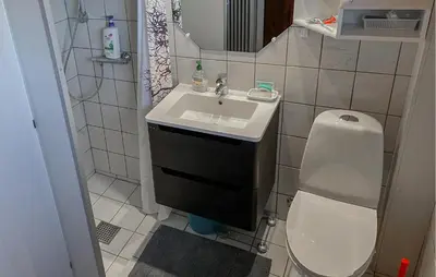 a small bathroom with a sink and a toilet at 3 Bedroom Cozy Home In Bøvlingbjerg in Bøvlingbjerg