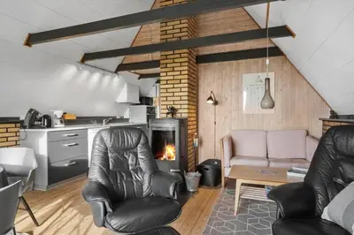 a living room with two chairs and a fireplace at 534-Lemvig-Lokkevej-13 in Lemvig