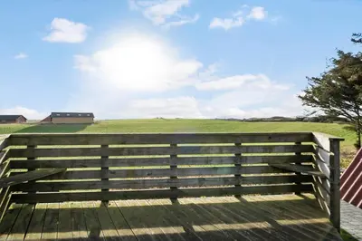 a wooden fence with a field in the background at 534-Lemvig-Lokkevej-13 in Lemvig
