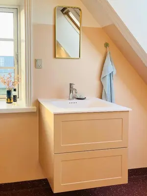 a bathroom with a sink and a mirror at Villa With Fjord View By Frederik Vii's Canal in Løgstør