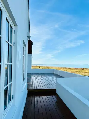 a balcony with a view of the ocean at Villa With Fjord View By Frederik Vii's Canal in Løgstør
