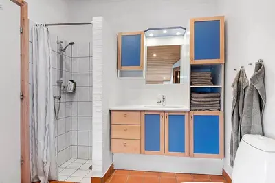 a bathroom with a sink and a shower at BL1144-Blokhus-Sixtusvej-27 in Blokhus