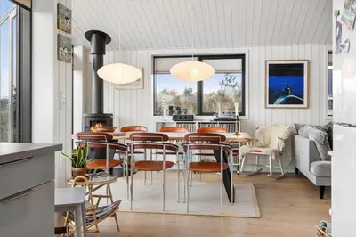 a dining room with a table and chairs at 1071-Thisted-Gravsesvej-30 in Klitmøller