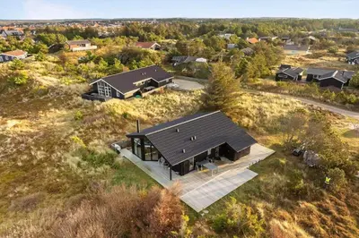 an overhead view of a house in a field at 1071-Thisted-Gravsesvej-30 in Klitmøller