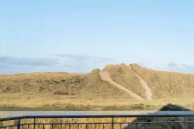 a view of a hill with two dirt roads on it at 729-Thyboron-Vesterhavsgade-112 in Thyborøn