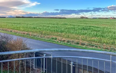 a bridge over a road with a field in the background at 6 Bedroom Awesome Home In Hurup Thy in Tvolm