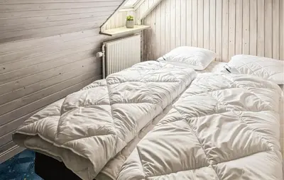 a group of four mattresses lined up in a room at 6 Bedroom Awesome Home In Hurup Thy in Tvolm