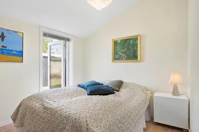 a white bedroom with a bed and a window at JB301-Fjerritslev-Landstien-3 in Fjerritslev