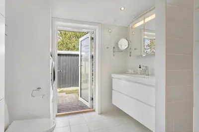 a white bathroom with a toilet and a sink at JB301-Fjerritslev-Landstien-3 in Fjerritslev