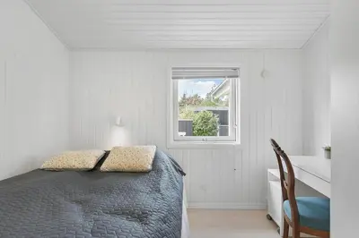 a bedroom with a bed and a window at JB301-Fjerritslev-Landstien-3 in Fjerritslev