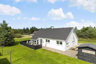a white house with a black roof at 1372-Thisted-Nordsovej-222 in Nørre Vorupør