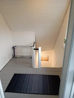 a hallway with a metal bench in a room at Bolig ved hav og fjord in Thyholm