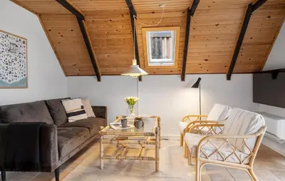 a living room with a couch and chairs and a table at 2 Bedroom Pet Friendly Home In Thisted in Thisted