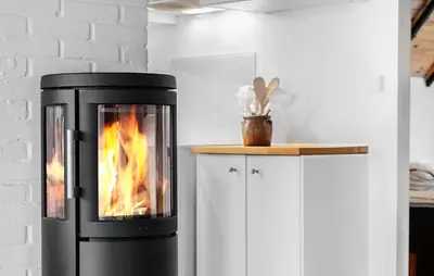 a stove in a kitchen with a fire in it at 2 Bedroom Pet Friendly Home In Thisted in Thisted