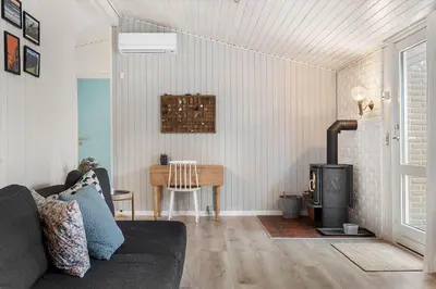 a living room with a couch and a wood stove at 741-Thisted-Klemsvej-29 in Nørre Vorupør